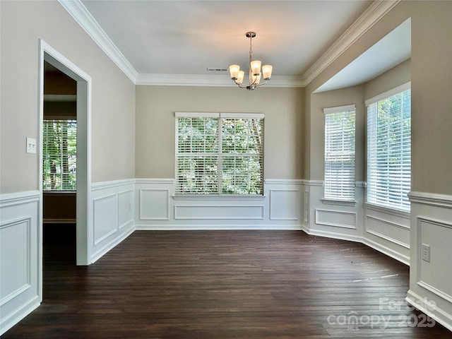 4504 Bellmore Ct, Charlotte, NC 28269 - spare room with a chandelier, dark wood-style flooring, ornamental molding, and a wainscoted wall