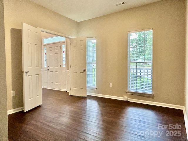 4504 Bellmore Ct, Charlotte, NC 28269 - entrance foyer featuring dark wood-type flooring and baseboards