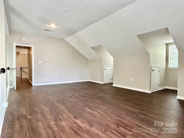 4504 Bellmore Ct, Charlotte, NC 28269 - bonus room with dark wood-style floors and lofted ceiling