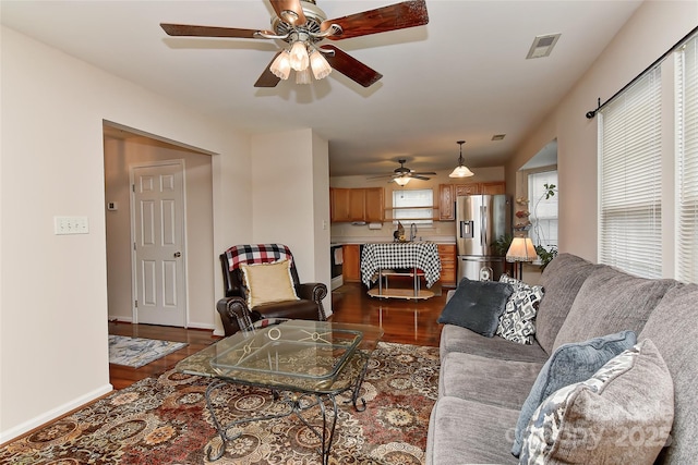 7007 Broad Leaf Ct, Indian Trail, NC 28079 - living room featuring dark wood finished floors, a ceiling fan, and baseboards