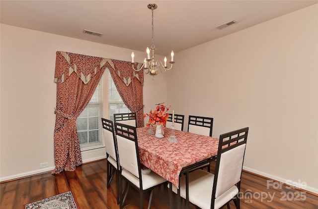 7007 Broad Leaf Ct, Indian Trail, NC 28079 - dining area featuring a chandelier, dark wood-type flooring, and baseboards