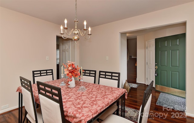 7007 Broad Leaf Ct, Indian Trail, NC 28079 - dining room featuring dark wood finished floors, a chandelier, and baseboards