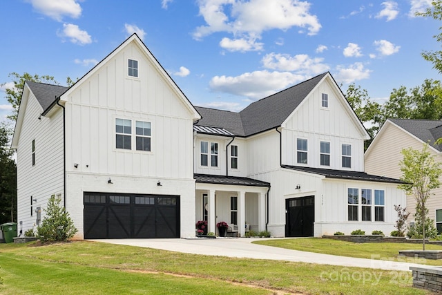 4530 Tournette Dr Unit 18, Indian Land, SC 29707 - modern farmhouse with a garage, board and batten siding, a front yard, and a standing seam roof