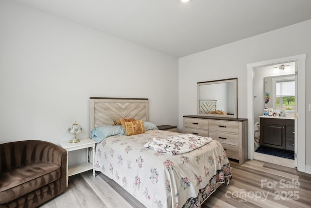 4530 Tournette Dr Unit 18, Indian Land, SC 29707 - bedroom featuring light wood-type flooring, a sink, and ensuite bathroom
