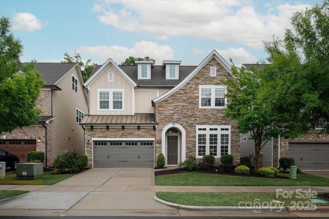 7913 Waverly Walk Ave, Charlotte, NC 28277 - view of front facade with stone siding, concrete driveway, a standing seam roof, an attached garage, and roof with shingles