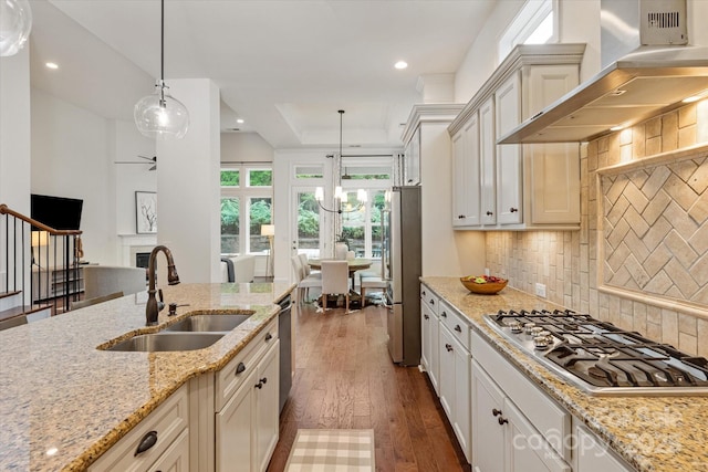 7913 Waverly Walk Ave, Charlotte, NC 28277 - kitchen with stainless steel appliances, wall chimney exhaust hood, a sink, dark wood finished floors, and recessed lighting