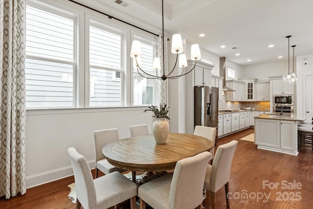 7913 Waverly Walk Ave, Charlotte, NC 28277 - dining area featuring dark wood finished floors, a chandelier, recessed lighting, and baseboards
