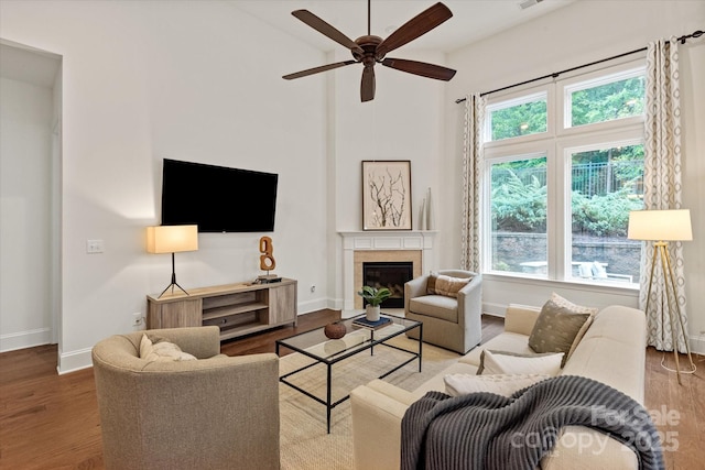 7913 Waverly Walk Ave, Charlotte, NC 28277 - living area featuring ceiling fan, baseboards, high vaulted ceiling, wood finished floors, and a fireplace