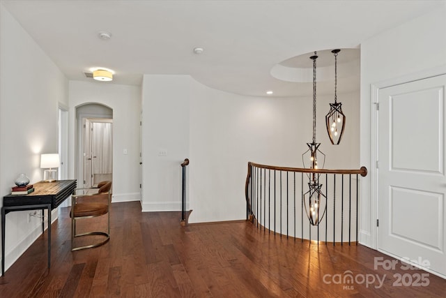 7913 Waverly Walk Ave, Charlotte, NC 28277 - hall featuring wood finished floors, arched walkways, and baseboards