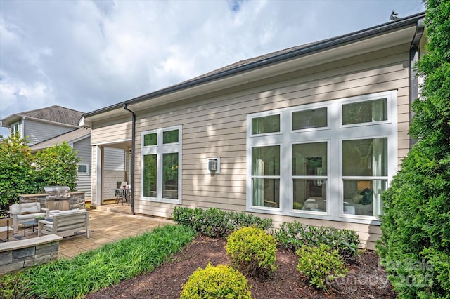 7913 Waverly Walk Ave, Charlotte, NC 28277 - back of property with area for grilling and a patio area