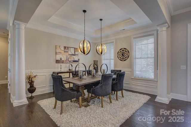 14503 Crest Ct, Charlotte, NC 28278 - dining room with decorative columns, dark wood-type flooring, a raised ceiling, a decorative wall, and wainscoting