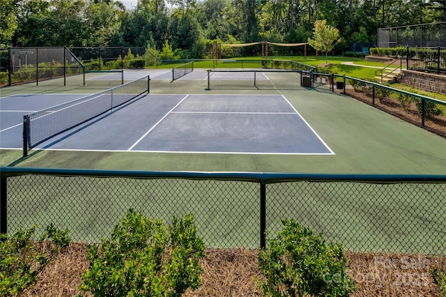 14503 Crest Ct, Charlotte, NC 28278 - view of tennis court featuring view of scattered trees