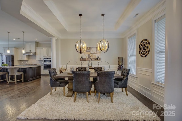 14503 Crest Ct, Charlotte, NC 28278 - dining area with dark wood-style flooring, a tray ceiling, ornamental molding, a chandelier, and recessed lighting