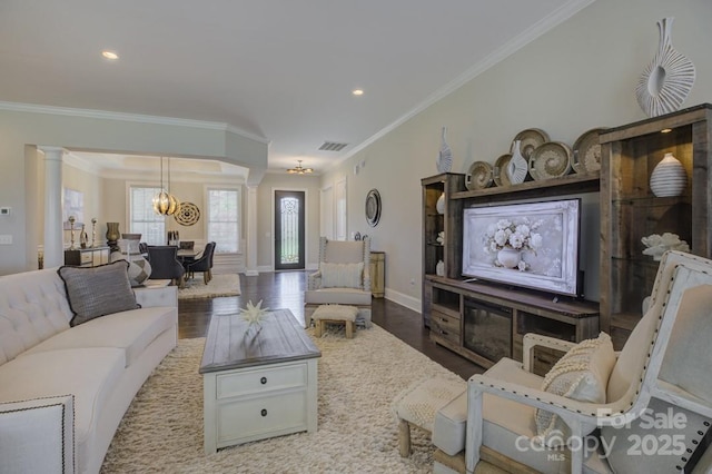 14503 Crest Ct, Charlotte, NC 28278 - living area featuring a chandelier, ornamental molding, wood finished floors, recessed lighting, and decorative columns