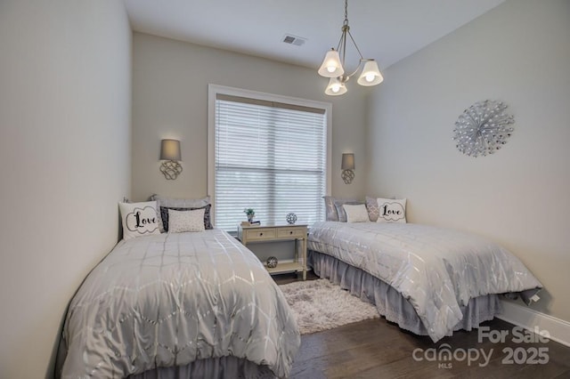 14503 Crest Ct, Charlotte, NC 28278 - bedroom featuring wood finished floors and a chandelier
