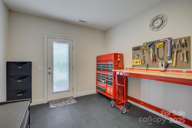 14503 Crest Ct, Charlotte, NC 28278 - misc room featuring baseboards and a workshop area