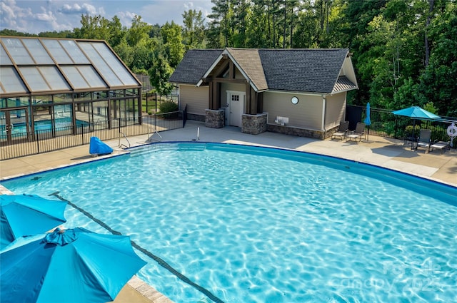 14503 Crest Ct, Charlotte, NC 28278 - view of swimming pool with a patio area and an outdoor structure