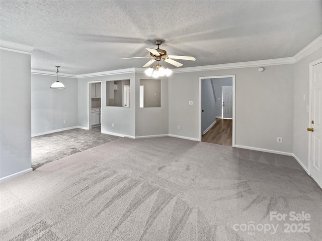 752 Raindrops Rd, Gastonia, NC 28054 - unfurnished living room with crown molding, ceiling fan, carpet, baseboards, and a textured ceiling