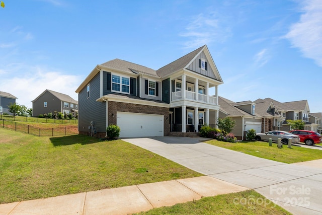 1001 Linn Cv, Waxhaw, NC 28173 - view of front of home featuring concrete driveway, an attached garage, a balcony, brick siding, and a residential view