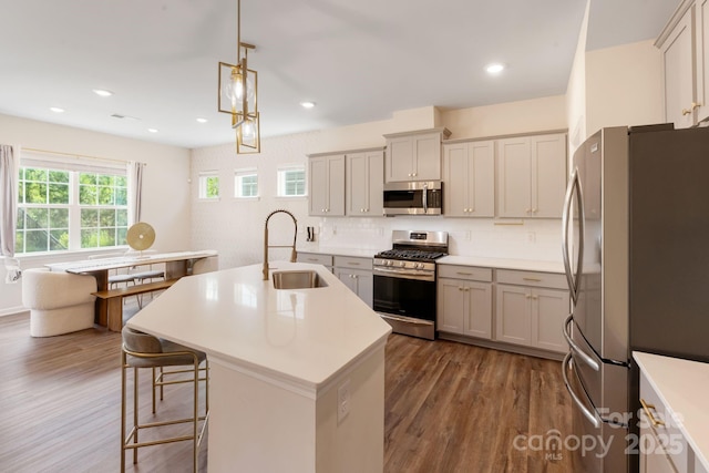 1001 Linn Cv, Waxhaw, NC 28173 - kitchen featuring stainless steel appliances, a sink, dark wood-style floors, decorative backsplash, and recessed lighting