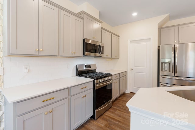 1001 Linn Cv, Waxhaw, NC 28173 - kitchen with stainless steel appliances, gray cabinets, dark wood-style floors, and recessed lighting