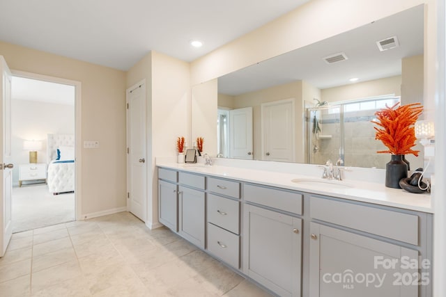 1001 Linn Cv, Waxhaw, NC 28173 - ensuite bathroom featuring double vanity, a stall shower, tile patterned floors, and baseboards