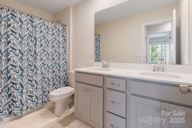 1001 Linn Cv, Waxhaw, NC 28173 - full bathroom with double vanity, toilet, a shower with shower curtain, and tile patterned floors