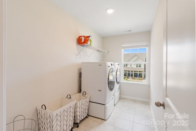 1001 Linn Cv, Waxhaw, NC 28173 - washroom with independent washer and dryer, light tile patterned floors, and baseboards