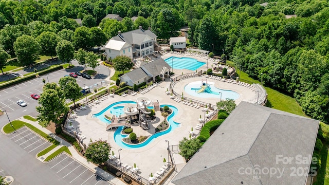 1001 Linn Cv, Waxhaw, NC 28173 - aerial view of a pool and a heavily wooded area
