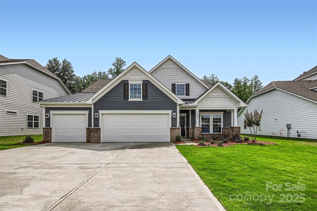 1528 Croydon St, Indian Land, SC 29707 - craftsman house featuring brick siding, driveway, a front yard, and an attached garage