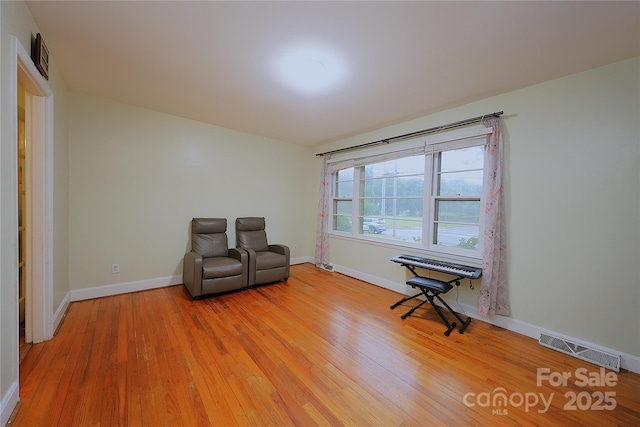 3016 Boston Ave, Charlotte, NC 28212 - living area with light wood-type flooring and baseboards