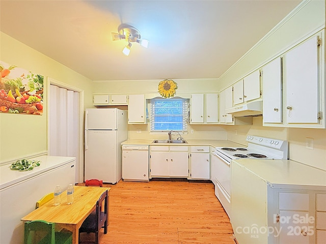 3016 Boston Ave, Charlotte, NC 28212 - kitchen featuring white appliances, under cabinet range hood, a sink, light countertops, and light wood-type flooring