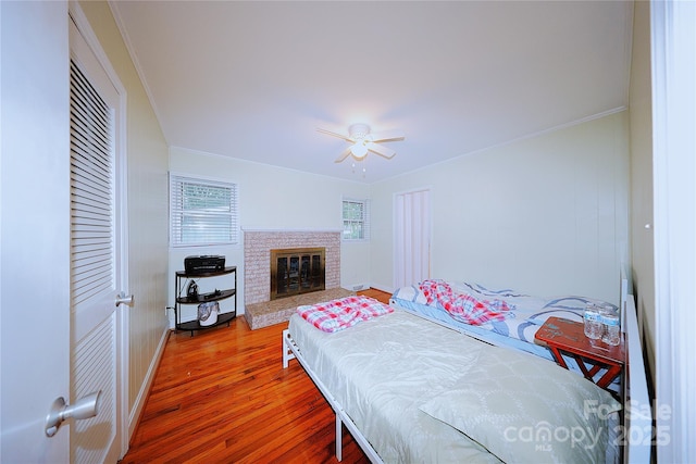 3016 Boston Ave, Charlotte, NC 28212 - bedroom featuring wood finished floors, crown molding, baseboards, a ceiling fan, and a closet