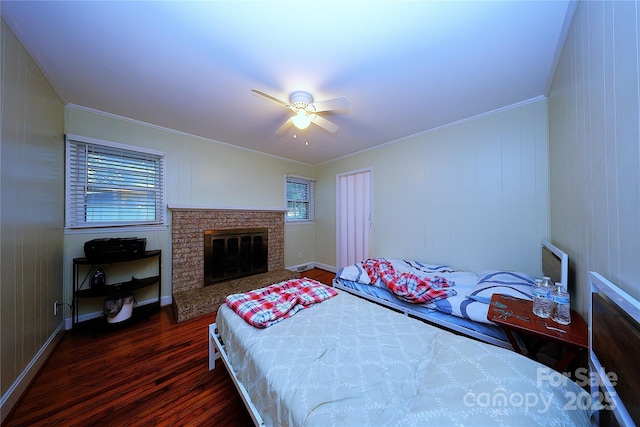 3016 Boston Ave, Charlotte, NC 28212 - bedroom with dark wood-style floors, ornamental molding, a brick fireplace, and ceiling fan