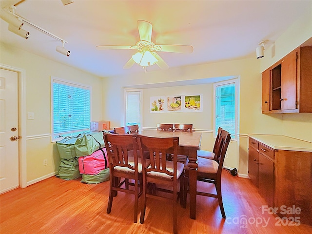3016 Boston Ave, Charlotte, NC 28212 - dining space with light wood finished floors, ceiling fan, baseboards, and track lighting