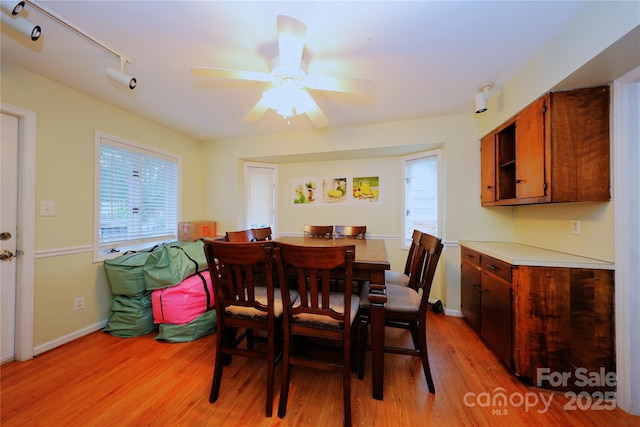 3016 Boston Ave, Charlotte, NC 28212 - dining space with light wood finished floors, a ceiling fan, and baseboards