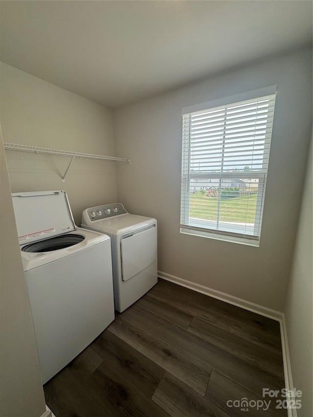 laundry room with separate washer and dryer, dark wood-style floors, and baseboards