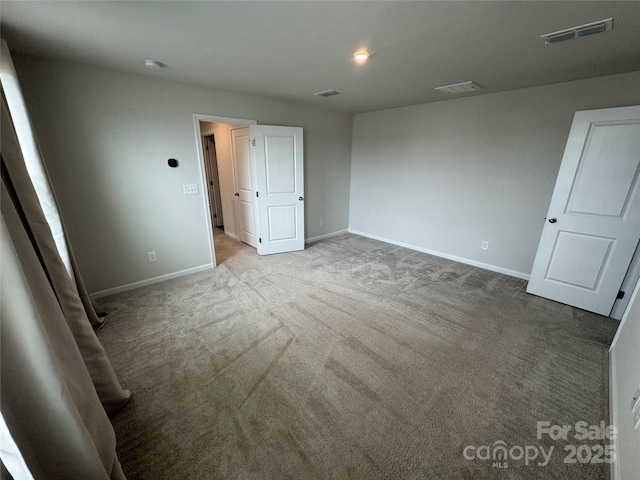 unfurnished bedroom with baseboards and carpet flooring