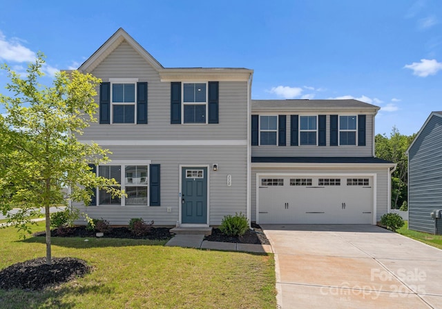 110 Browband St, Troutman, NC 28166 - view of front of house featuring a front yard, driveway, and a garage