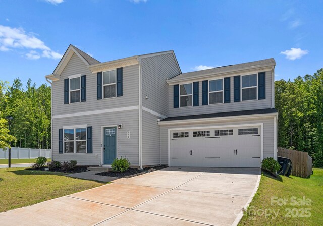 110 Browband St, Troutman, NC 28166 - traditional home with concrete driveway and a garage