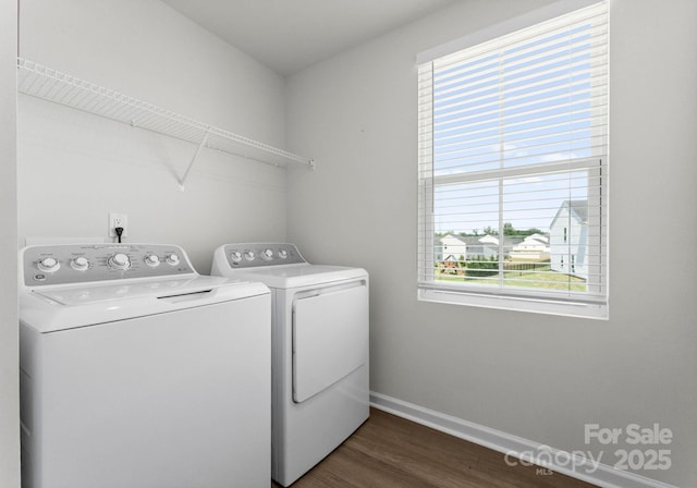 110 Browband St, Troutman, NC 28166 - laundry area with independent washer and dryer, dark wood-type flooring, baseboards, and healthy amount of natural light