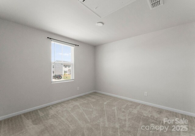 110 Browband St, Troutman, NC 28166 - carpeted spare room featuring attic access and baseboards