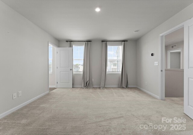 110 Browband St, Troutman, NC 28166 - carpeted spare room with plenty of natural light and baseboards