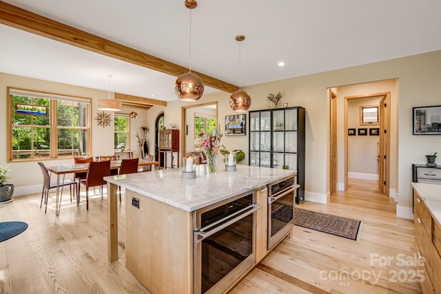 7 Bee Balm Way, Asheville, NC 28804 - kitchen with stainless steel oven, light wood-style floors, baseboards, recessed lighting, and beamed ceiling