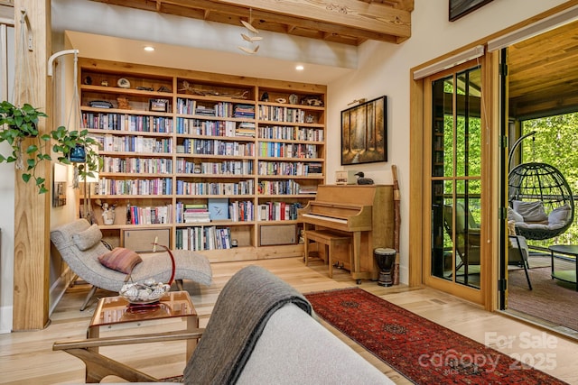 7 Bee Balm Way, Asheville, NC 28804 - sitting room with wood finished floors, built in shelves, and beam ceiling