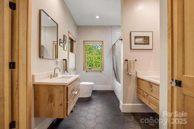 7 Bee Balm Way, Asheville, NC 28804 - bathroom featuring vanity, toilet, shower / bath combination with glass door, tile patterned floors, and baseboards