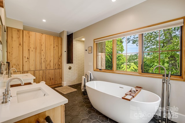 7 Bee Balm Way, Asheville, NC 28804 - full bath with double vanity, a freestanding bath, and recessed lighting