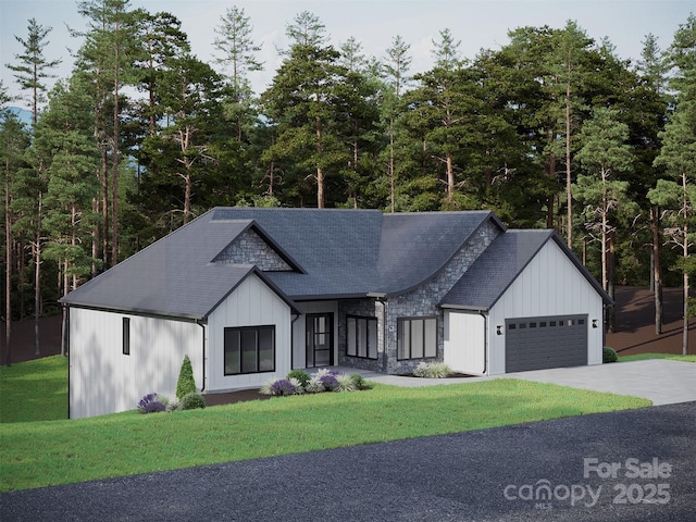 modern farmhouse with a garage, concrete driveway, stone siding, a front yard, and board and batten siding