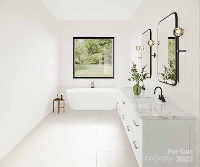 bathroom featuring a freestanding tub, tile patterned floors, double vanity, and baseboards