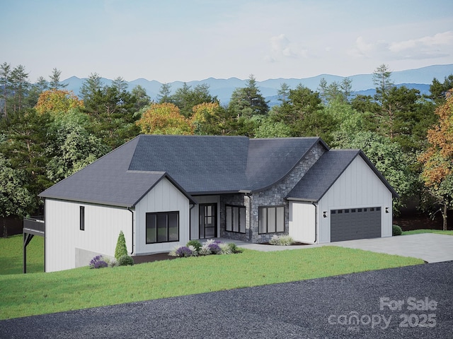 51 Bridgeway Dr Unit 12, Candler, NC 28715 - view of front of property with a garage, a front lawn, driveway, a mountain view, and stone siding